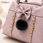 Premium Muted Mauve Embossed Floral Leather Satchel Handbag with Bow, Black Pompom & Gold Accents - Image 4